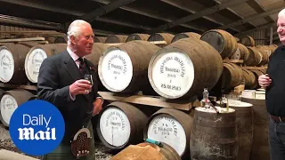 Prince Charles wears a kilt while on northern distillery tour