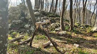 Making a workbench in a rocky forest. Cooking meat on coals.