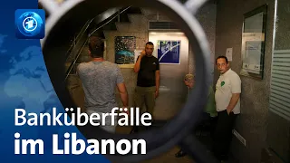 Menschen im Libanon wollen mit Banküberfällen an ihr eigenes Geld