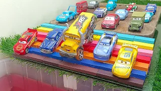 Disney Pixar Various Cars McQueen and Friends bounce and roll down Into the violet water