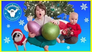 KID DECORATING CHRISTMAS TREE! Giant Surprise Eggs Disney Godzilla and Paw Patrol Everest ornaments