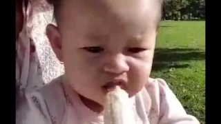 Baby eats banana for the very first time