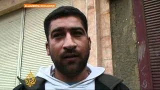 Homs residents in 'war zone'