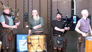 Thundering drums of Scottish band Clanadonia playing Ya Bassa on the steps of Scone Palace, Scotland