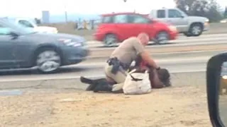 Officer caught on camera punching woman