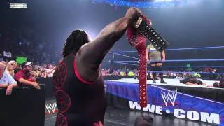 Friday Night SmackDown - Big Show chokeslams Mark Henry through the announce table