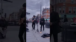 U2 Bono and The Edge performing on the streets of London?  Or is it tribute artists?