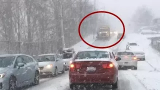 Snow plow slides downhill and crashes into cars (CAUGHT ON CAM)
