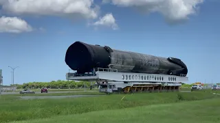 SpaceX Falcon 9 booster on the road to hangar after space station cargo mission