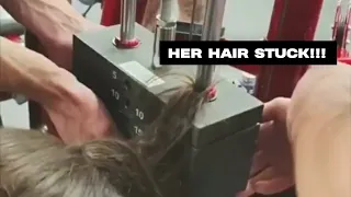 This woman's hair got stuck on a gym equipment .