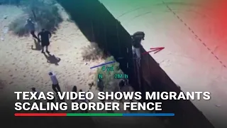 Texas video shows migrants scaling border fence