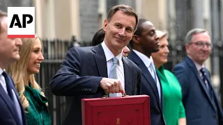 UK Chancellor Jeremy Hunt leaves Downing Street with red box ahead of delivering budget
