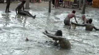 Summersault into mud bath Tubing Vang Vieng Laos