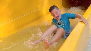 BEST WATERPARK PLAYGROUND EVER!! Caleb PLAYS in a VOLCANO at VOLCANO BAY! Splash Pad for Kids!