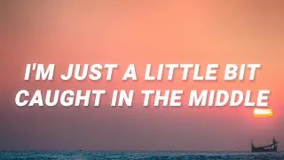 Lenka - I'm just a little bit caught in the middle (The Show) (Lyrics)