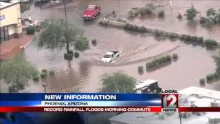 Cars engulfed as rain sets record for Phoenix