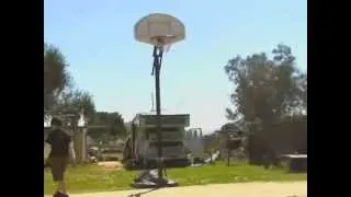 Nikolas and Little Jimmy shooting basketball