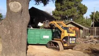 Most Productive Skid Steer Grapple Attachment Period Demo-Dozer! Dumpster Loading  the easy way.