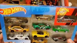 Lots of models  and toys of new and used cars in a big box