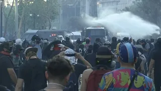 Chilean police fire water cannons at anti-government protesters | AFP