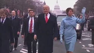 President Trump and First Lady walking in inaugural parade