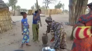 Pounding peanuts near Touba Senegal