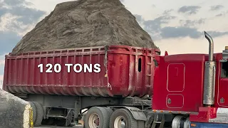 trucks are unloading 5,500 tons of sand & gravel onto a barge S6.E1