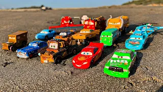 Disney Pixar Cars fall into the water: Lightning McQueen, Doc Hudson, Dinoco, Jackson Storm