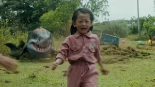 The girl is swinging, but a mutant shark sprang out from behind her!