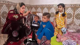 Single Mother and Her Kids Enjoy an Electric Fan on Their Farm