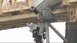 Driver saved from truck dangling off Kentucky bridge in daring rescue