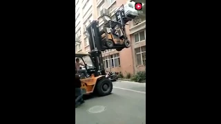 Double forklift load into second floor window fails miserably!