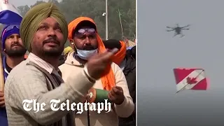 Indian farmers use kites to down tear gas dropping drones