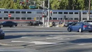 Officer Rescues Man Seconds Before Train Smashes Into Car