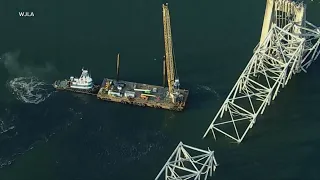 Crews to begin removing Baltimore bridge debris with floating cranes