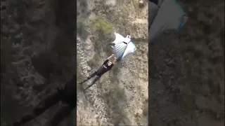 BASE Jumper HANGS ON TO Wingsuit 😎#shorts #funny #adrenaline #skydiving #viral