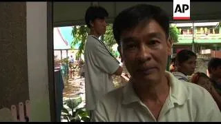 Students and teachers assess damage to flooded school