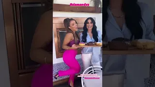 Mandy Rose and  Sonya Deville pose with  donuts 7/28/2022