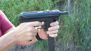 TEC-9 with a silencer. Yes, it's a TEC-9, just like it says on the gun.