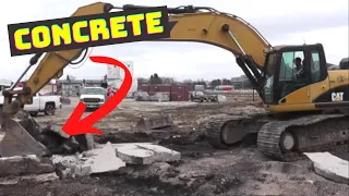 Breaking Concrete With A CAT 330D Excavator and Loading Trucks