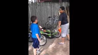 Kid pisses on bike. Kid rages