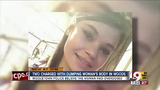 Two charged with dumping woman's body in woods