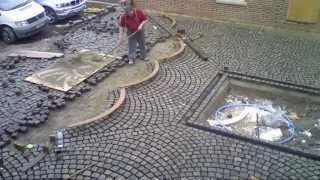 laying reclaimed granite setts for driveway and courtyard to French style