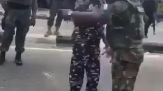 Moment a soldier berates a police officer for shooting at a crowd