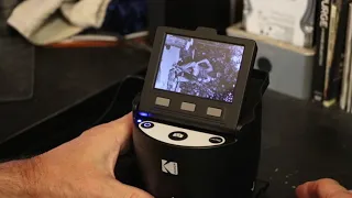 Scanning old film negatives with a Kodak Scanza film scanner.