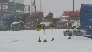 Truck drivers fighting rough roads during winter storm