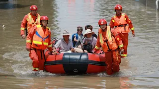 What are the roots of the devastating flood in China's Henan Province?