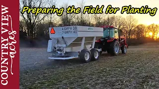 Spreading Fertilizer on Future Pasture and Cleaning up the Burnt Brush Pile