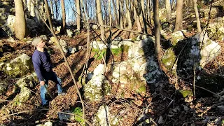 Hiking in the mountains, primitive bushcraft shelter. Cooking meat and tortillas over hot coals.