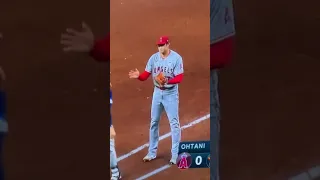 Kyle Tucker holds his hand out to let Shohei tag it